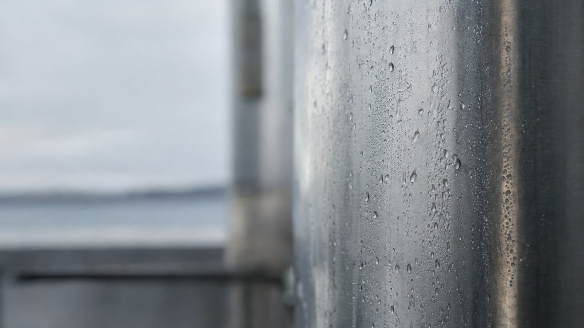 An abstract study: condensation on cool stainless steel under reflected grey coastal light
